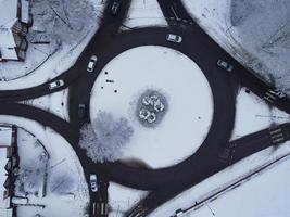 High angle view of Snow covered North Luton's landscape and Cityscape, Aerial Footage of Northern Luton City of England UK after Snow Fall. The 1st Snow Fall of this Winter of 2022 photo