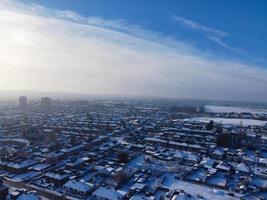 High angle view of Snow covered North Luton's landscape and Cityscape, Aerial Footage of Northern Luton City of England UK after Snow Fall. The 1st Snow Fall of this Winter of 2022 photo