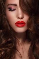 Portrait of beautiful woman with red lips photo