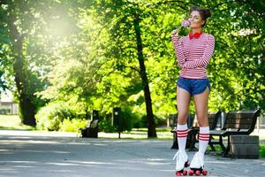 Woman on the roller-skate in the park photo