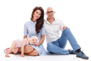 Young and happy family. Parents with her cute daughter. photo