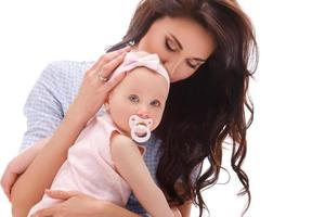 Mother with beautiful little daughter on white background photo