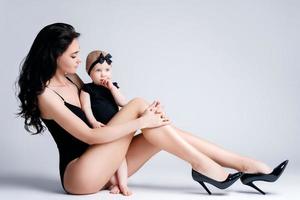 Young mother and her beautiful little daughter photo