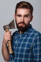 Portrait of handsome bearded man in checkered shirt photo