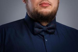Closeup shot of Bearded man wearing bow tie photo