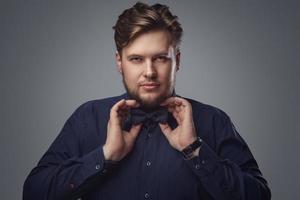 Handsome man with beard wearing bow tie photo