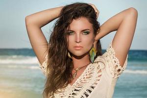 Portrait of young charming woman on the beach photo