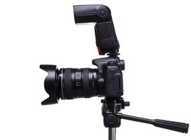 DSLR camera on tripod with external flash photo