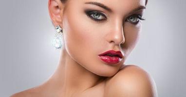 Portrait of gorgeous woman with luxury earrings photo