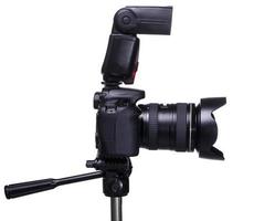 DSLR camera on tripod with external flash photo