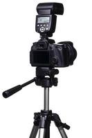 DSLR camera on tripod with external flash photo