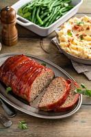 Meatloaf with mashed potatoes and green beans photo