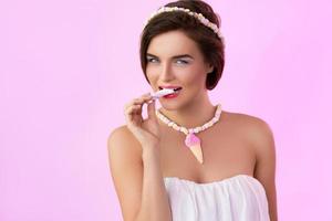 Cute woman wearing accessories which was made from marshmallow photo