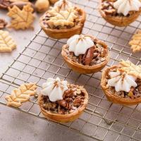 Mini pecan pies baked in a muffin tin photo