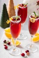Christmas mimosa with cranberry juice and orange photo