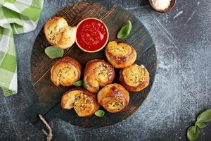 Garlic dinner rolls with marinara sauce photo