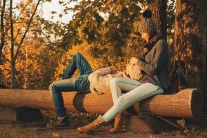 Young and happy couple in the autumn park photo