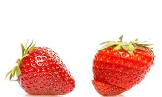 Fresh ripe sliced strawberry on white background photo