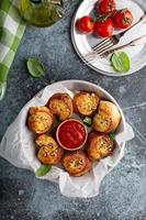 Garlic dinner rolls with marinara sauce photo