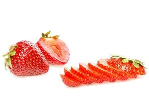 Fresh ripe sliced strawberry on white background photo