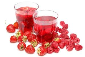 Glasses of drink of strawberry and raspberry on white background photo