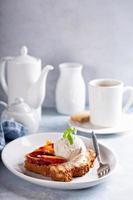 French toast with peaches and vanilla ice cream photo