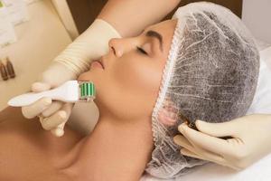 Beautiful woman in beauty salon during mesotherapy procedure. photo