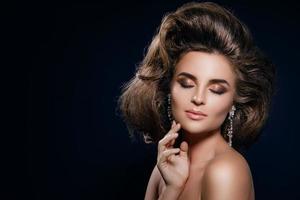 Gorgeous woman with a beautiful hairstyle and make-up photo