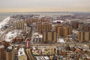 Aerial view of a snow covered roofs of buildings in Brighton Beach during the winter in Brooklyn, New York photo