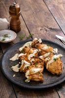 Roasted chicken thighs with pickle dill sauce photo