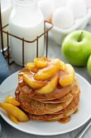 Pancakes with apple caramel topping photo
