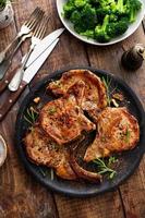 Grilled or pan fried pork chops on the bone photo