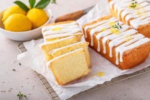 Classic lemon pound cake with powdered sugar glaze dripping over photo