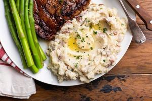 Traditional steak and mashed potatoes with asparagus photo