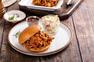 Pulled bbq chicken on a brioche bun photo