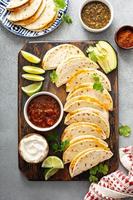 Baked tacos with pulled chicken and cheese photo