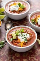 Traditional chili soup with meat and red beans photo