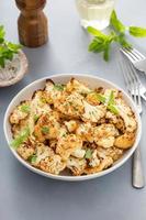 Roasted cauliflower with fresh herbs and spices photo