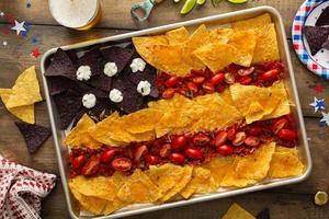 American flag nachos on a big tray with chips and salsa photo