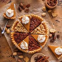 Traditional fall Thanksgiving pie slices, pumpkin and pecan pie photo