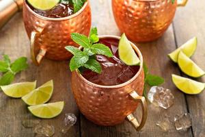 Traditional Moscow Mule in classic copper mugs photo