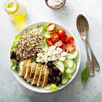 Greek inspired lunch bowl with chicken and quinoa photo