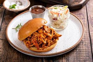 Pulled bbq chicken on a brioche bun photo