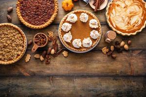 Traditional fall Thanksgiving pies, pumpkin and pecan pie photo