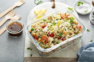 Healthy low carb salad with cauliflower rice and chickpeas photo