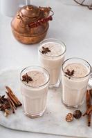 Chai in tall glasses with whole spices photo