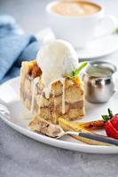 Warm apple bread pudding with ice cream photo