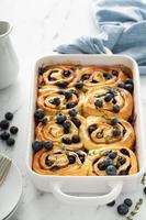 Summer breakfast idea, blueberry cinnamon rolls in a baking dish photo