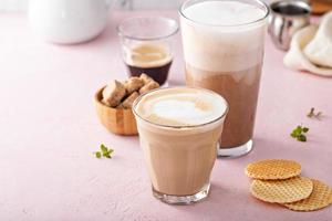 Coffee and espresso drinks in glasses, latte and mocha photo