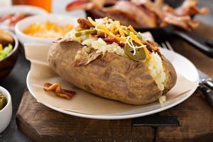 Fully loaded baked potato with all the toppings photo